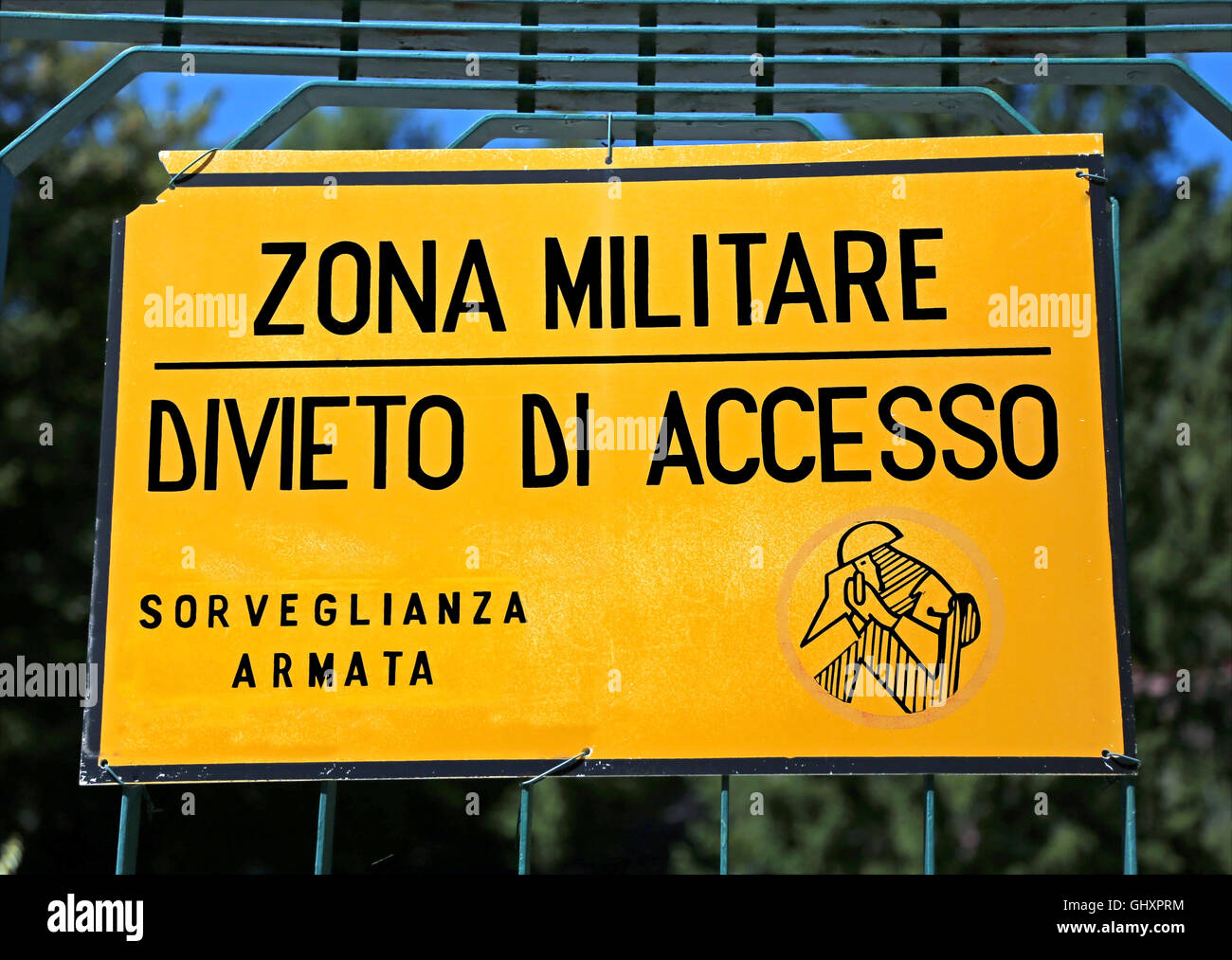 Italian sign of a military area with inscription that means military zone ban on armed surveillance access Stock Photo