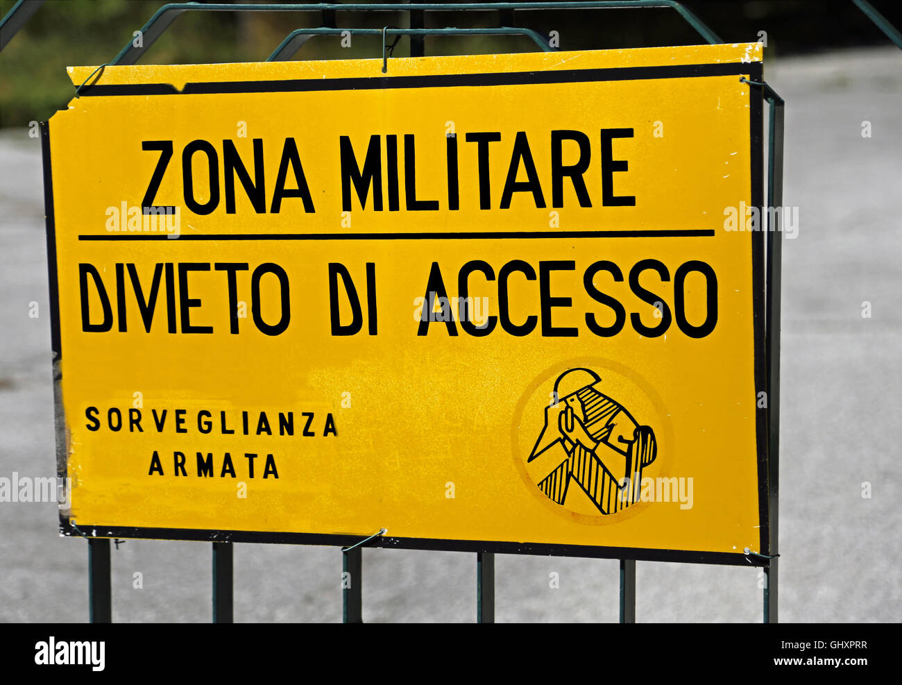 Italian sign of a military area with written that means military zone ban on armed surveillance access Stock Photo