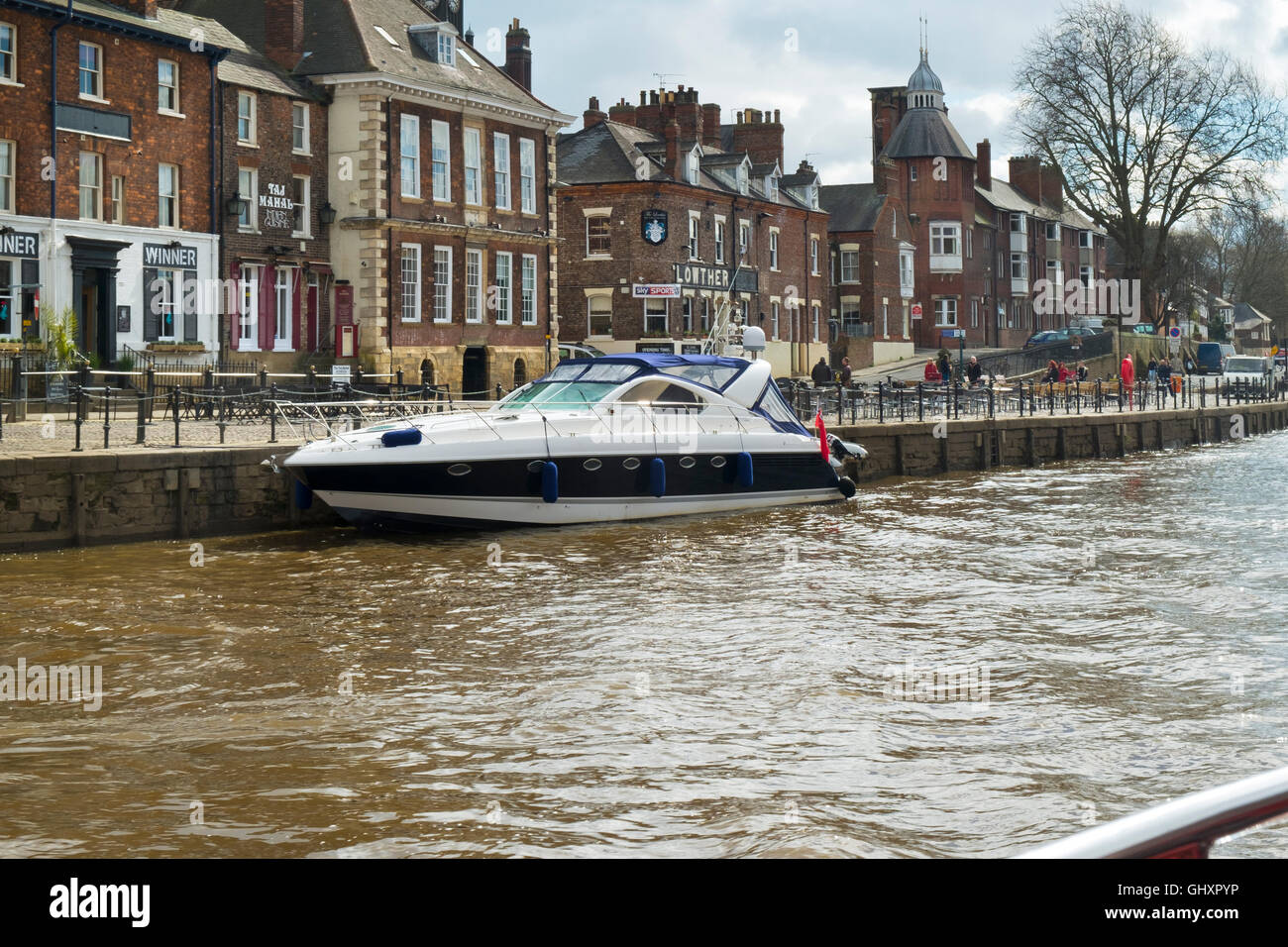 Trip boat sightseeing in spring sunshine on the River Ouse, City of York, Yorkshire, UK Stock Photo