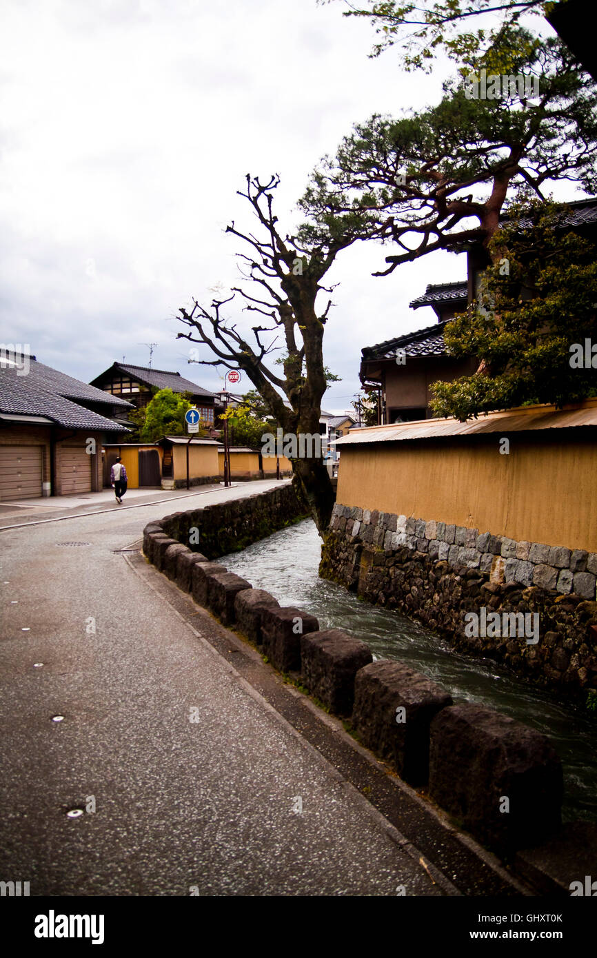 A man walks through the quiet old teahouse district of Kanazawa, Japan. Stock Photo