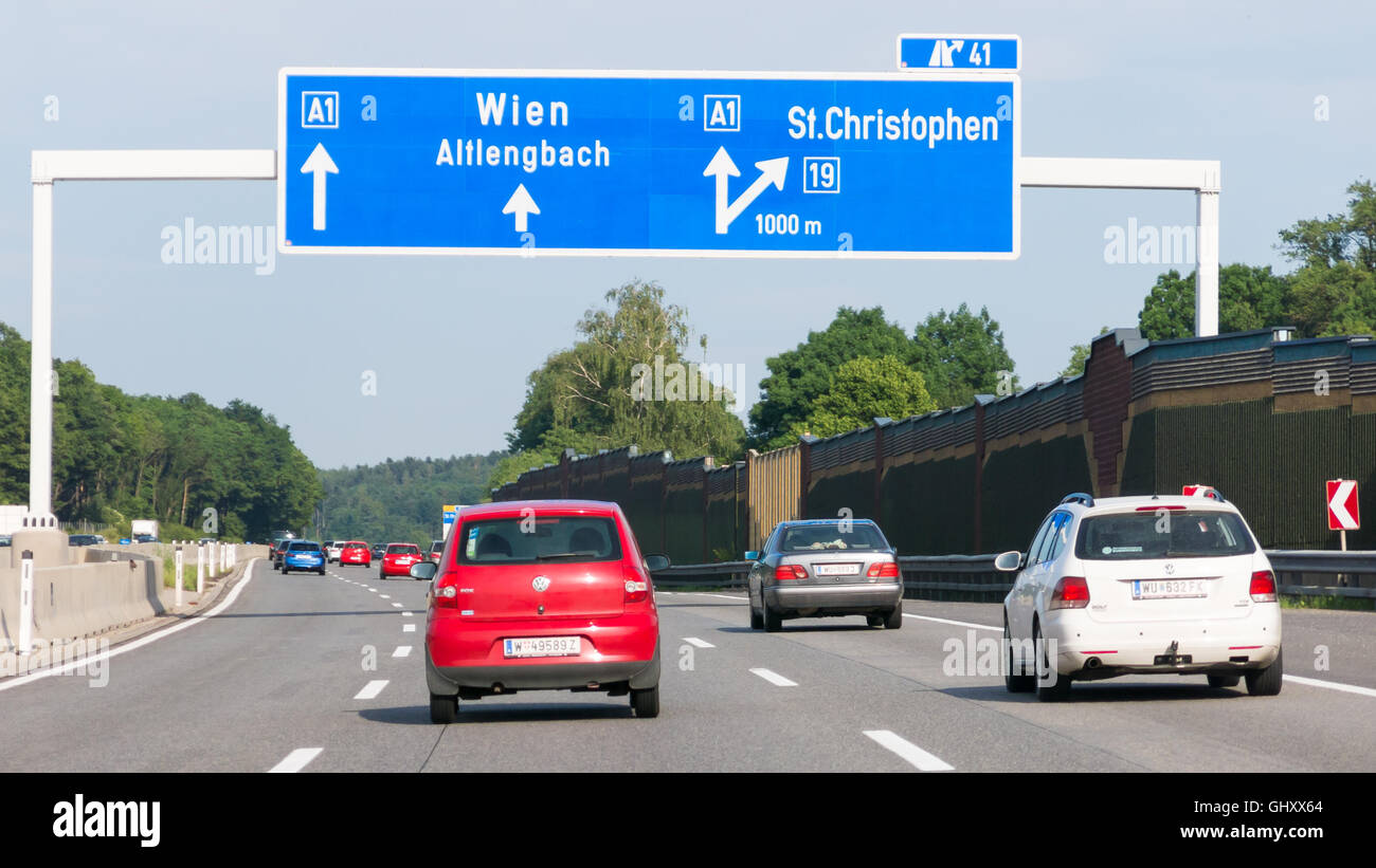 Traffic and direction signs on Autobahn motorway A1 in Vienna woods, Lower Austria, Austria Stock Photo