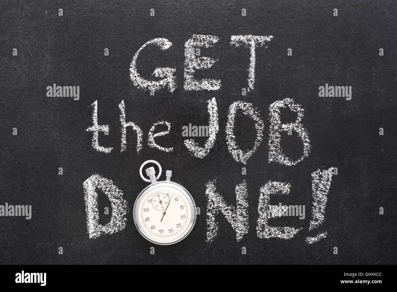 get the job exclamation handwritten on chalkboard with vintage precise stopwatch used instead of O Stock Photo