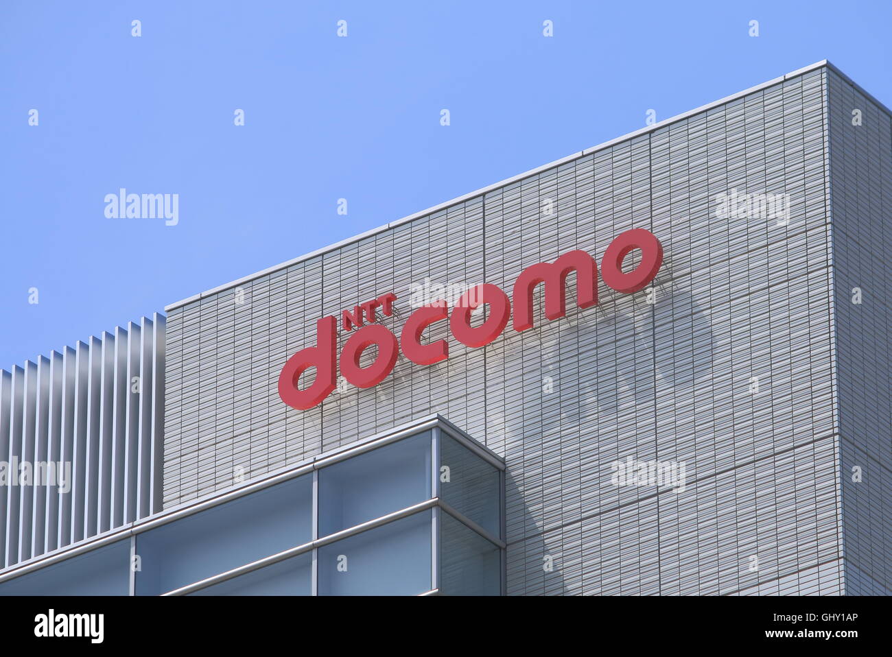 NTT Docomo company logo, the predominant mobile phone operator in Japan headquartered in Tokyo. Stock Photo