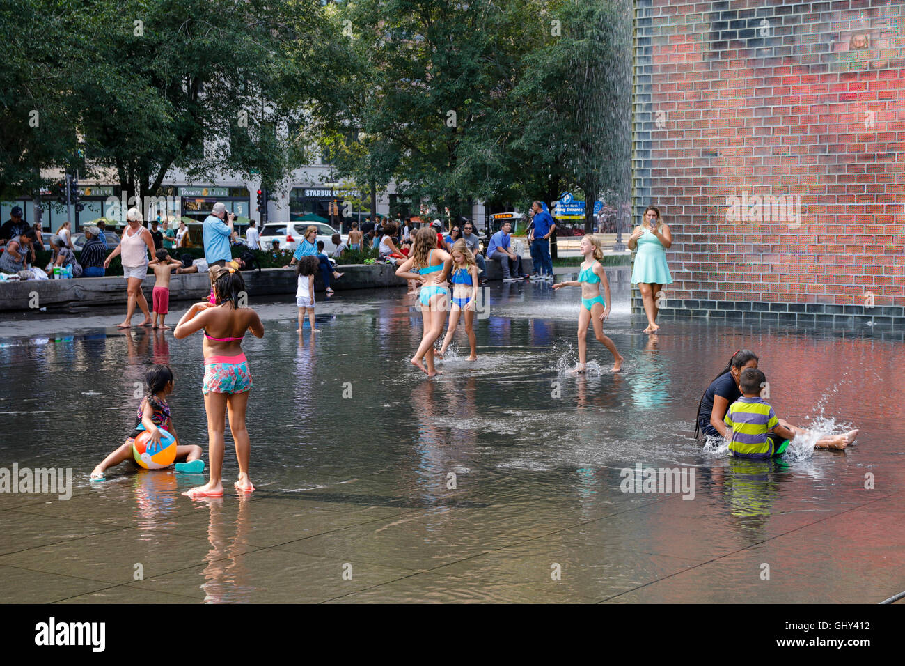 Children playing in Crown Fountain. Millennium Park, Chicago, Illinois. Stock Photo