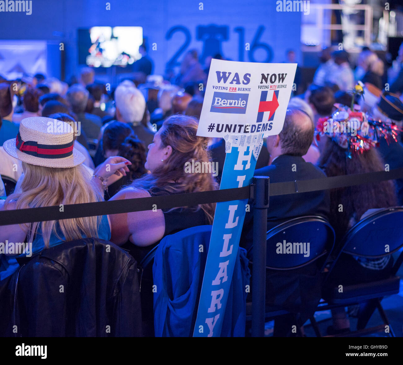 A sign saying "Was voting for Bernie, Now voting with Bernie" Sign stands attached with a Hillary sign, advocating unity Stock Photo