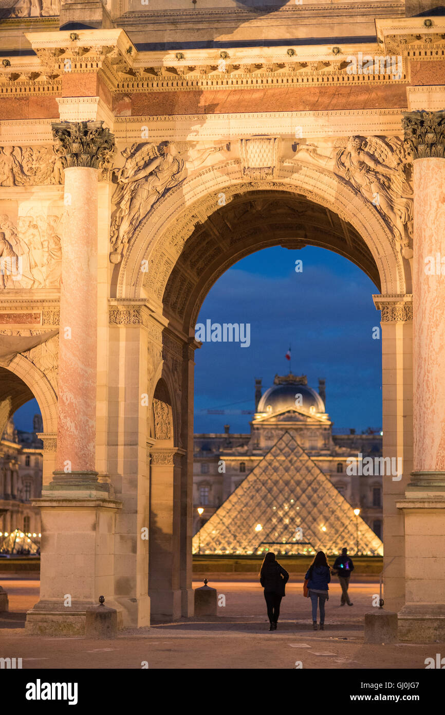 the Arc de Triomphe du Carrousel & Palais du Louvre at dusk, Paris, France Stock Photo