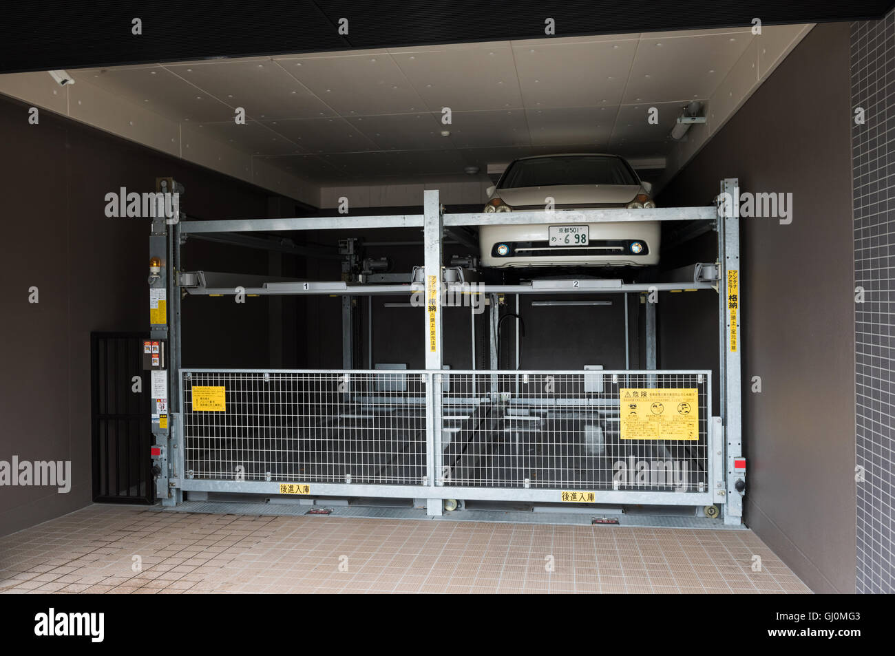 Kyoto, Japan - November 17, 2015: Japanese style Multilevel Car Parking System at a private apartment block. Stock Photo