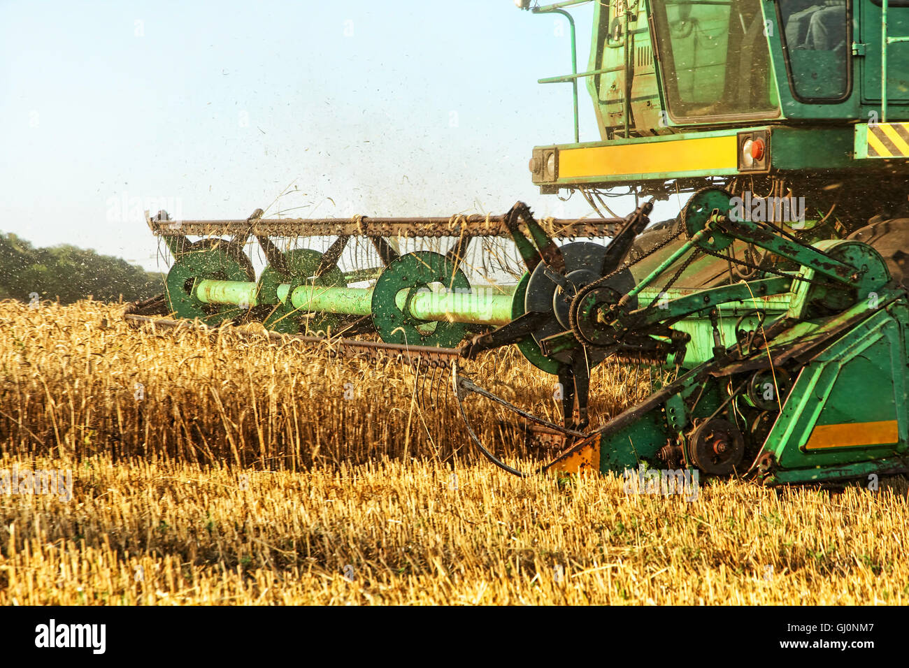 Combine harvester in agriculture field taken closeup. Stock Photo