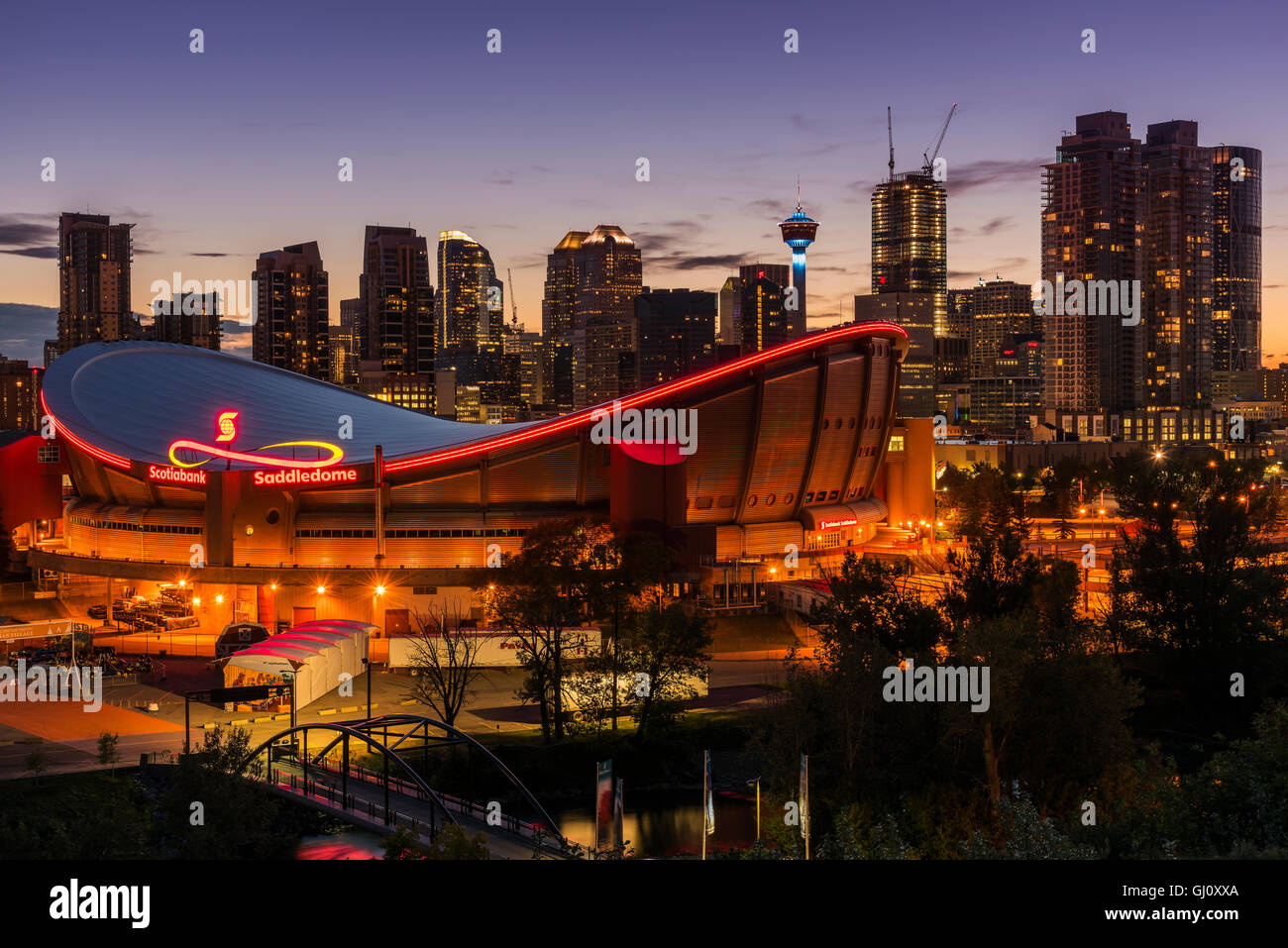 Night view of Saddledome stadium and city skyline, Calgary, Alberta, Canada Stock Photo