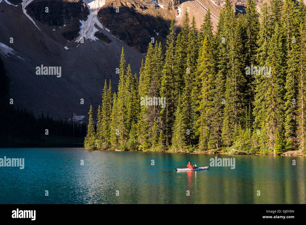 Canoeist in Moraine Lake, Banff National Park, Alberta, Canada Stock Photo