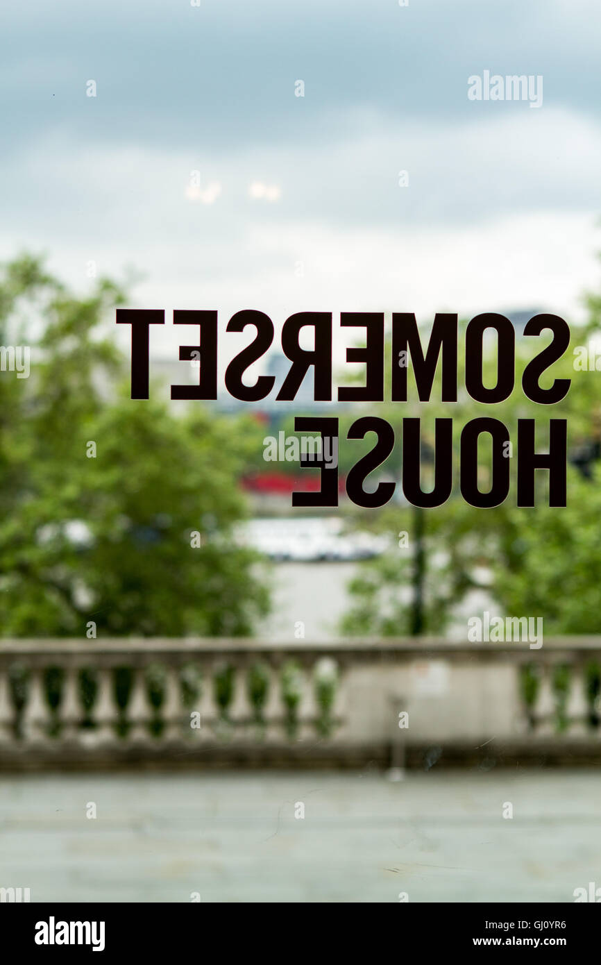 View through glass door of Somerset house towards terrace over the River Thames, London, UK Stock Photo