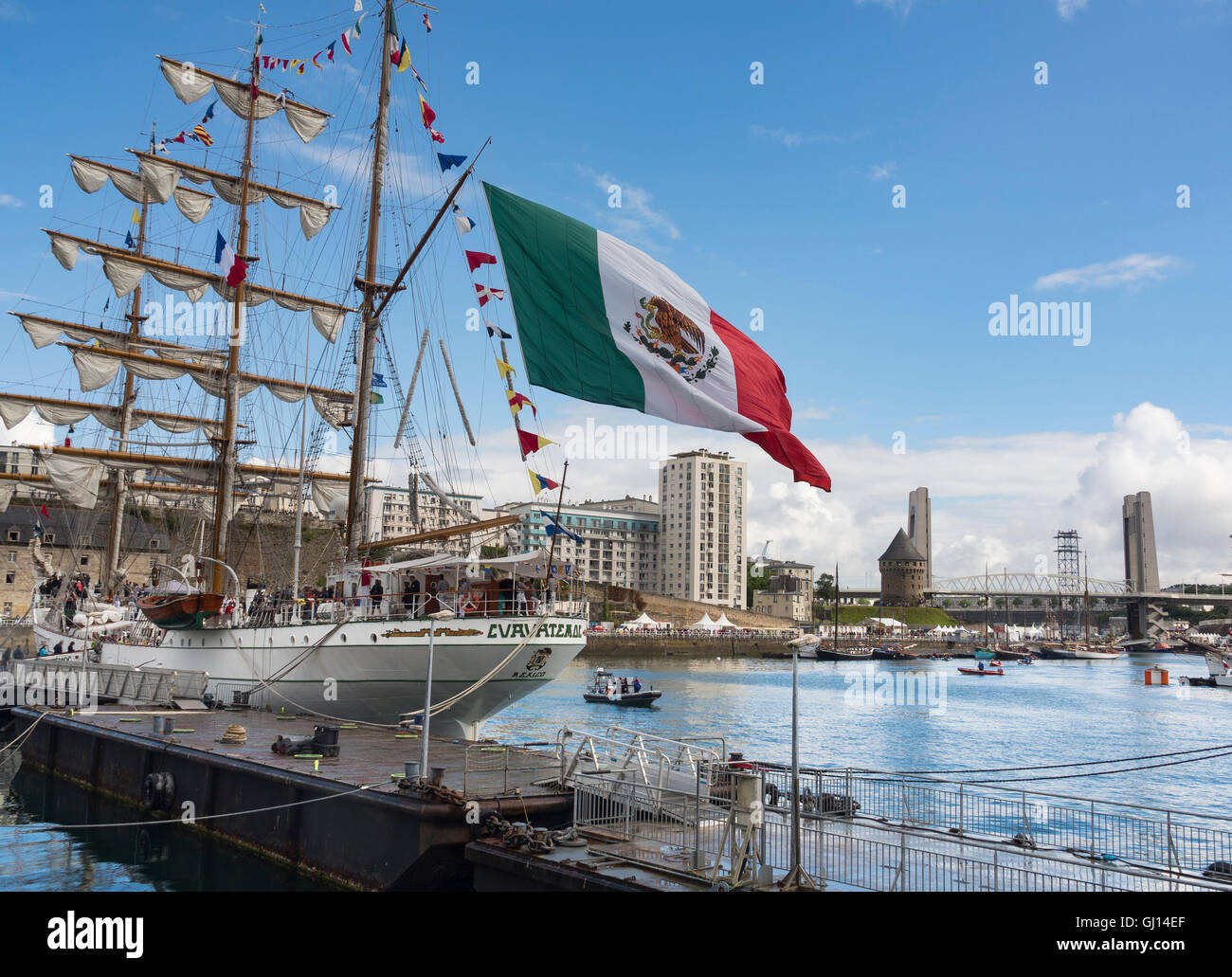 Mexican flag floats on the school sailboat Cuauhtémoc moored on Penfeld during the Brest’s International Maritime Festival 2016. Stock Photo