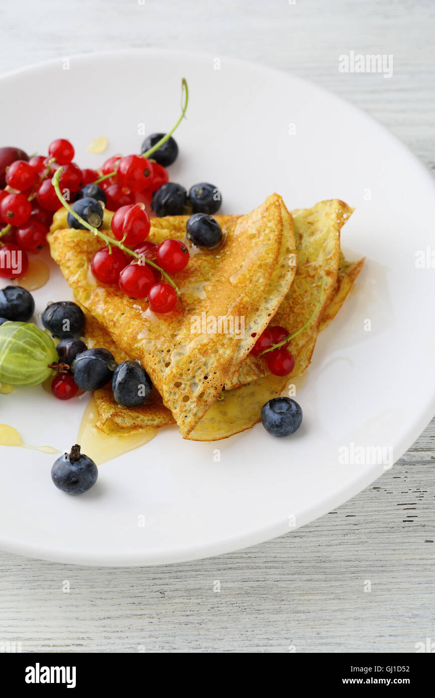Hot pancake with sauce and berries. Food closeup Stock Photo Alamy