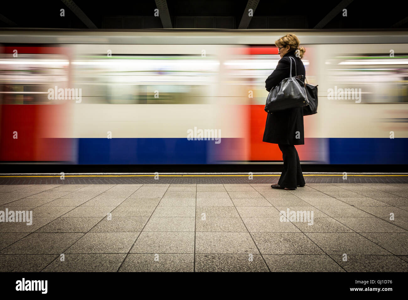 Woman train platform hi-res stock photography and images - Alamy