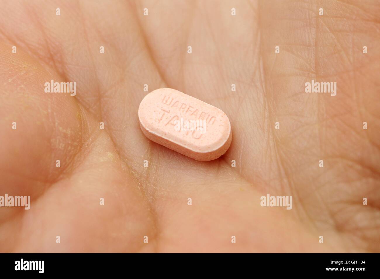 5mg warfarin tablet, the generic form of Coumadin, an anticoagulant. Stock Photo