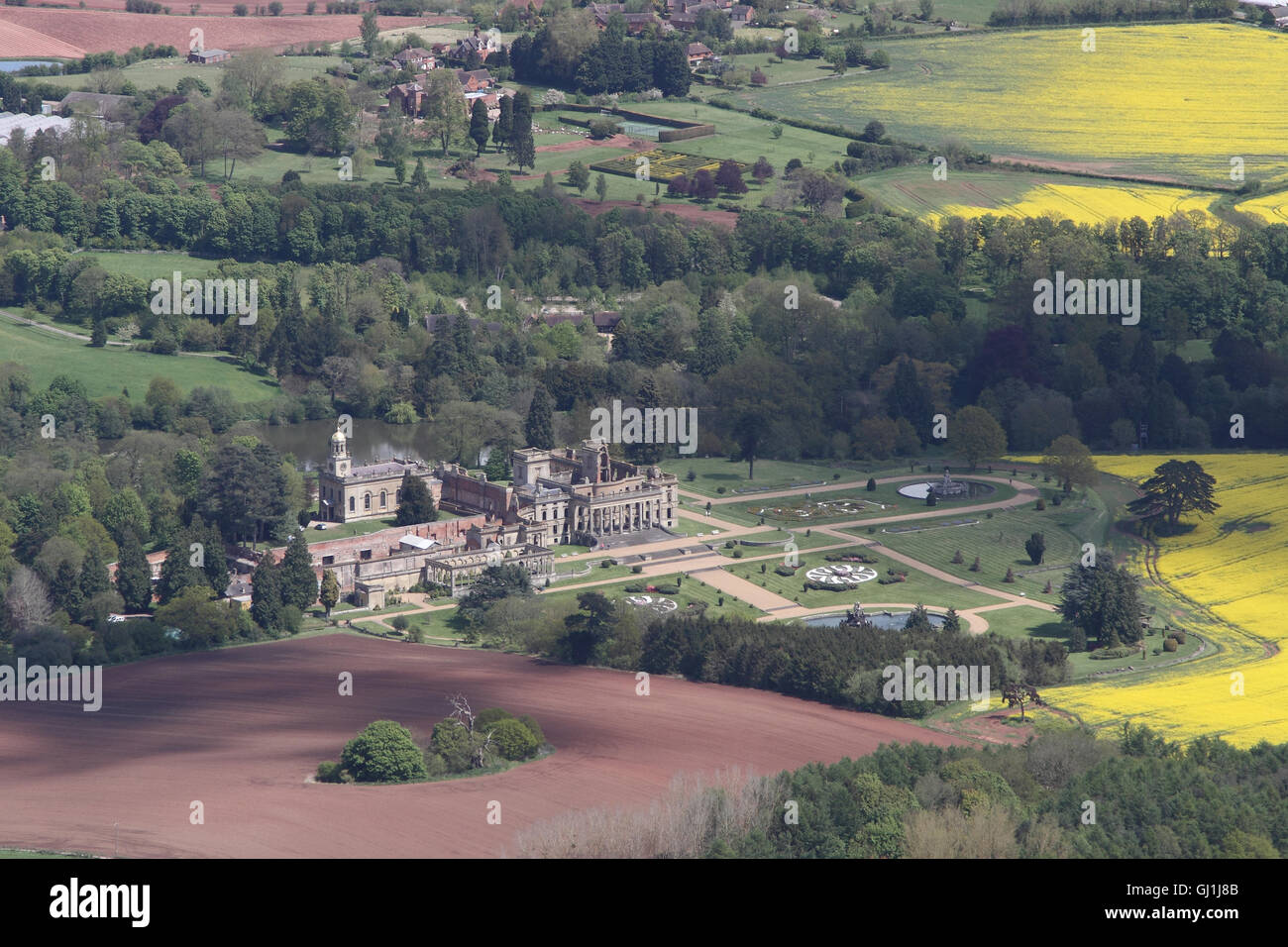 Aerial views of English Heritage Witley Court and gardens near Great Witley set amongst the yellow rapeseed fields of the Worcesterhire countryside Stock Photo