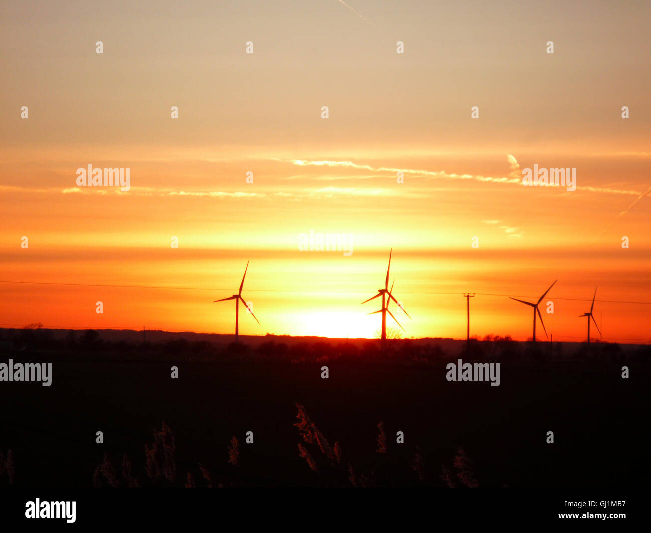 Sunset at the wind farm Mablethorpe Lincolnshire Stock Photo