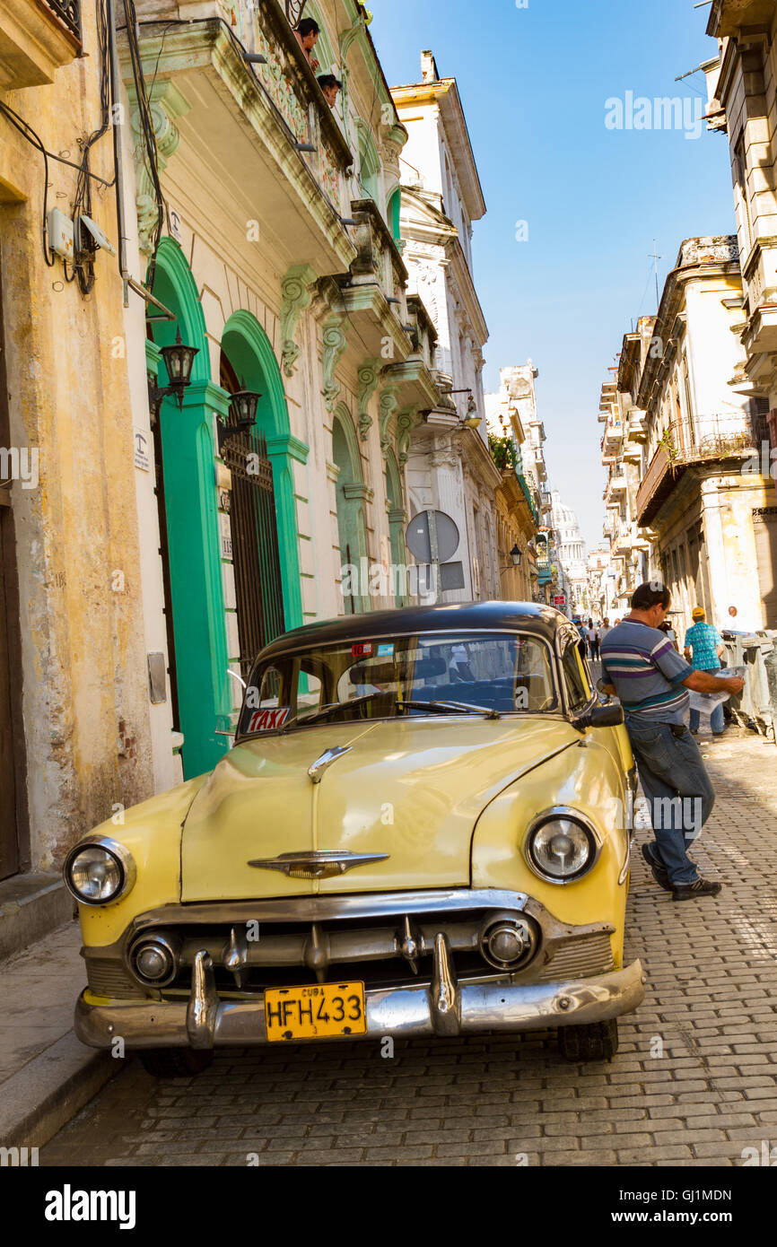 Vintage yellow car, front view, in  street , Havana, Cuba, 2013. Stock Photo