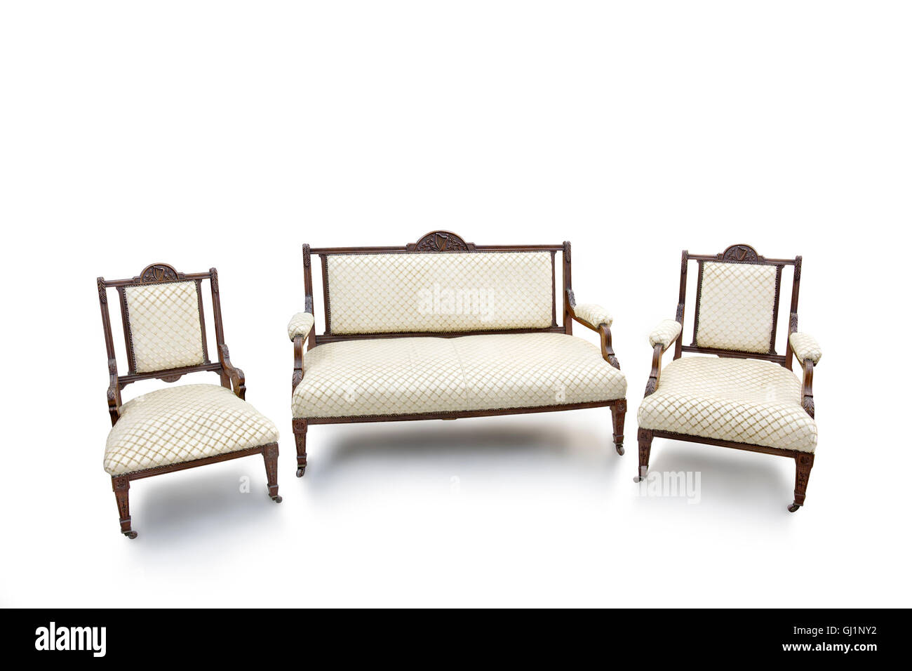 Antique wood armchairs and sofa. Stock Photo