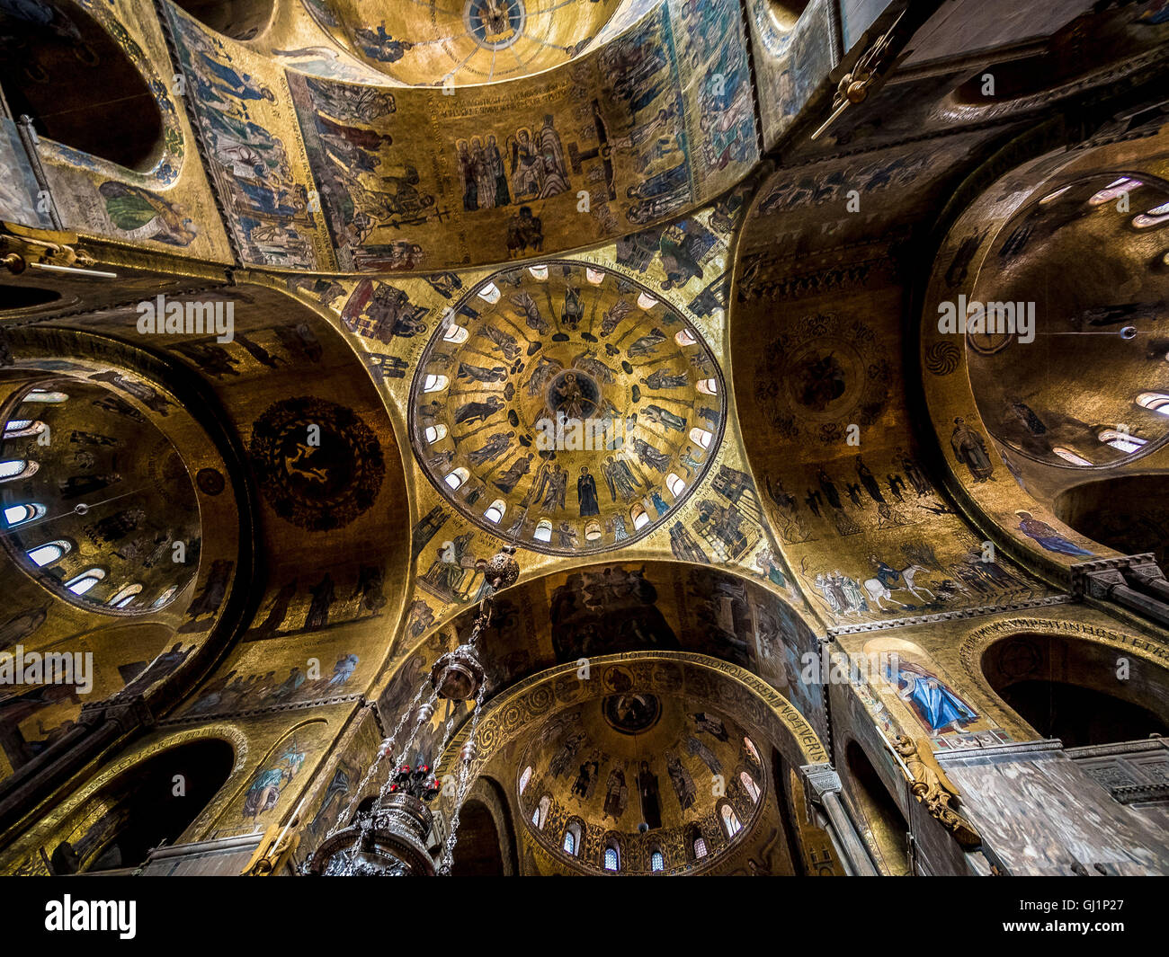 Interior of St Mark's basilica showing the 5 golden mosaiced ceiling domes. Venice, Italy. Stock Photo
