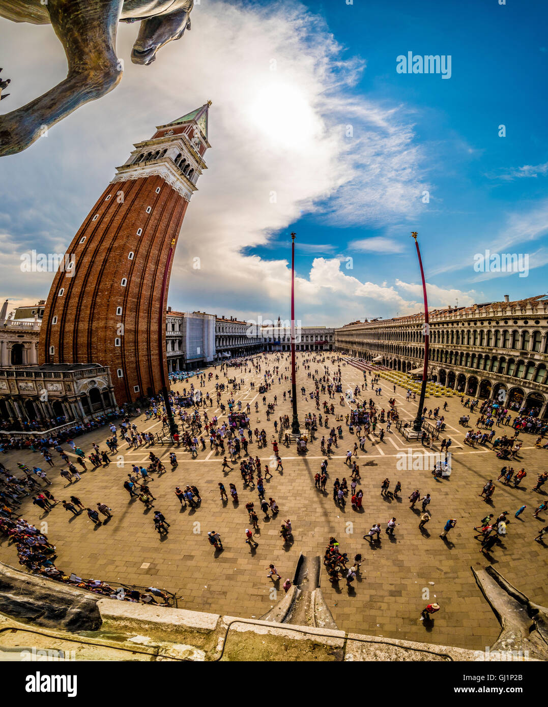 Fisheye shot of San Marco Campanile, with a busy Piazza San Marco, Venice, Italy. Stock Photo