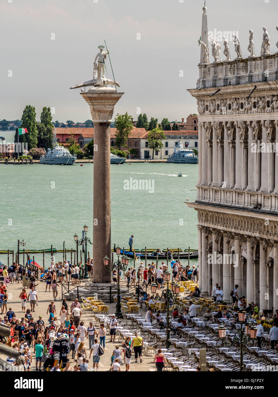 Piazzetta di San Marco along with Biblioteca Marciana and St Theodore's column, looking out towards Molo and St Mark's Basin. Stock Photo