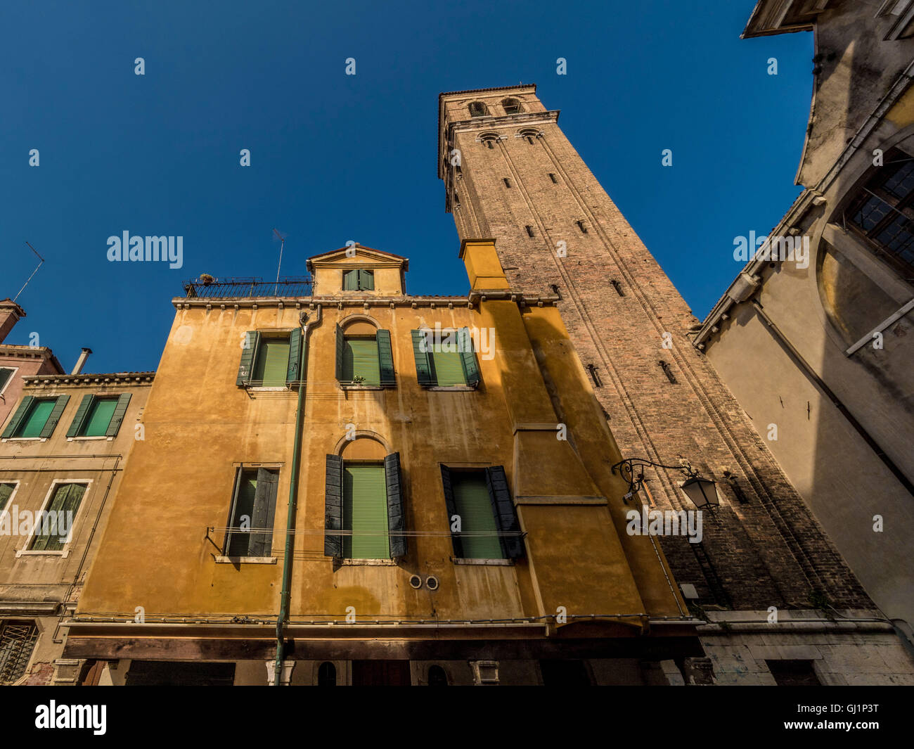 Traditional venetian rendered building. with window shutters and venetian blinds. Venice, Italy. Stock Photo