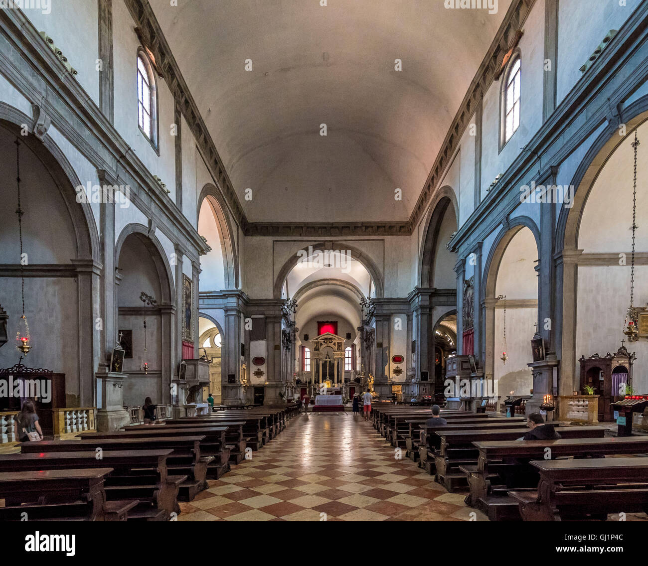 Interior aisle, altar and wooden pews of San Francesco della Vigna,Venice, Italy. Stock Photo