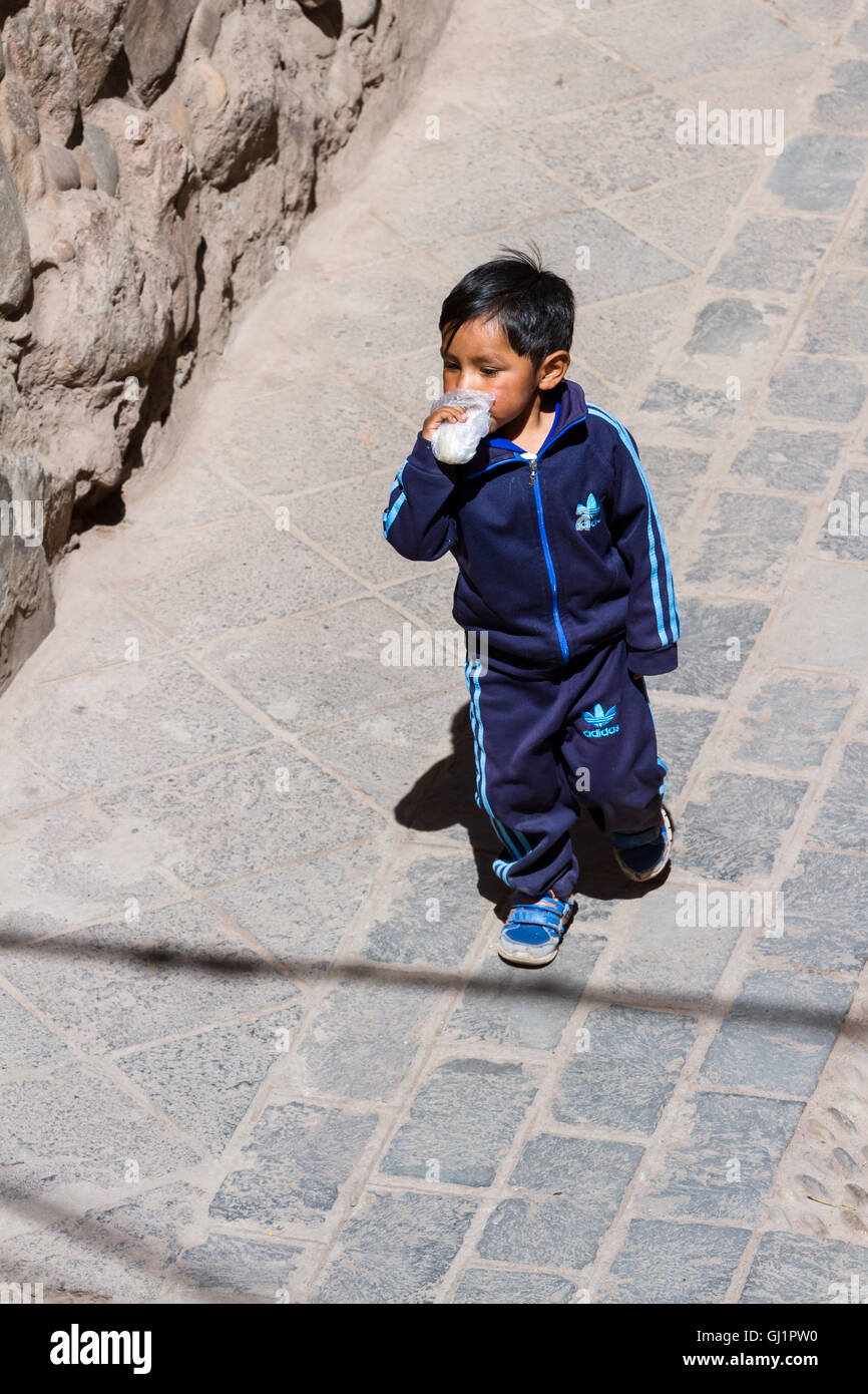 Pisac, Peru - May 15: Young boy walking dressed up in full Adidas clothing  in the Sacred Valley Market. May 15 2016, Pisac Peru Stock Photo - Alamy