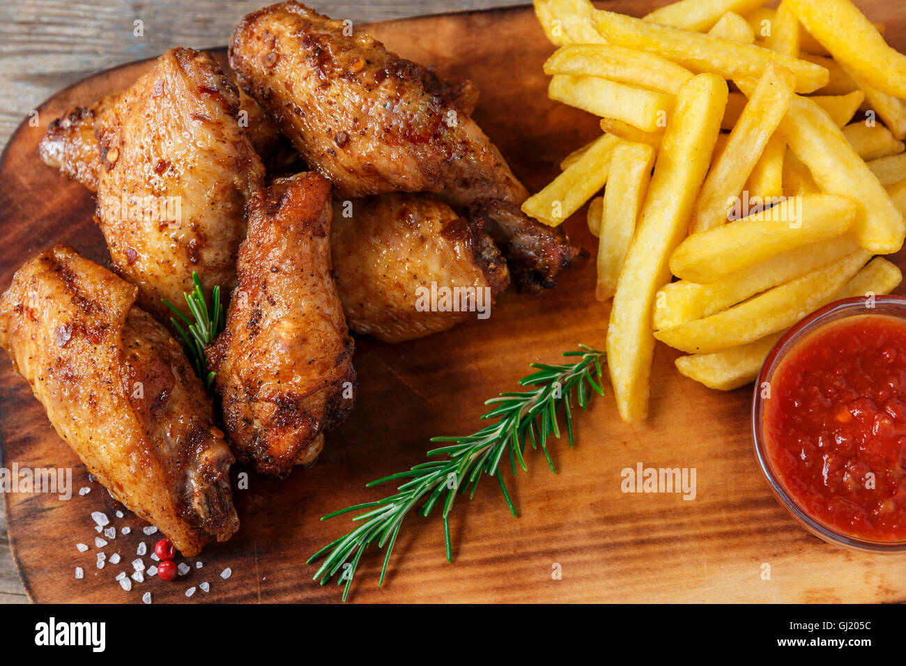 fried chicken wings french fries and sauce Stock Photo