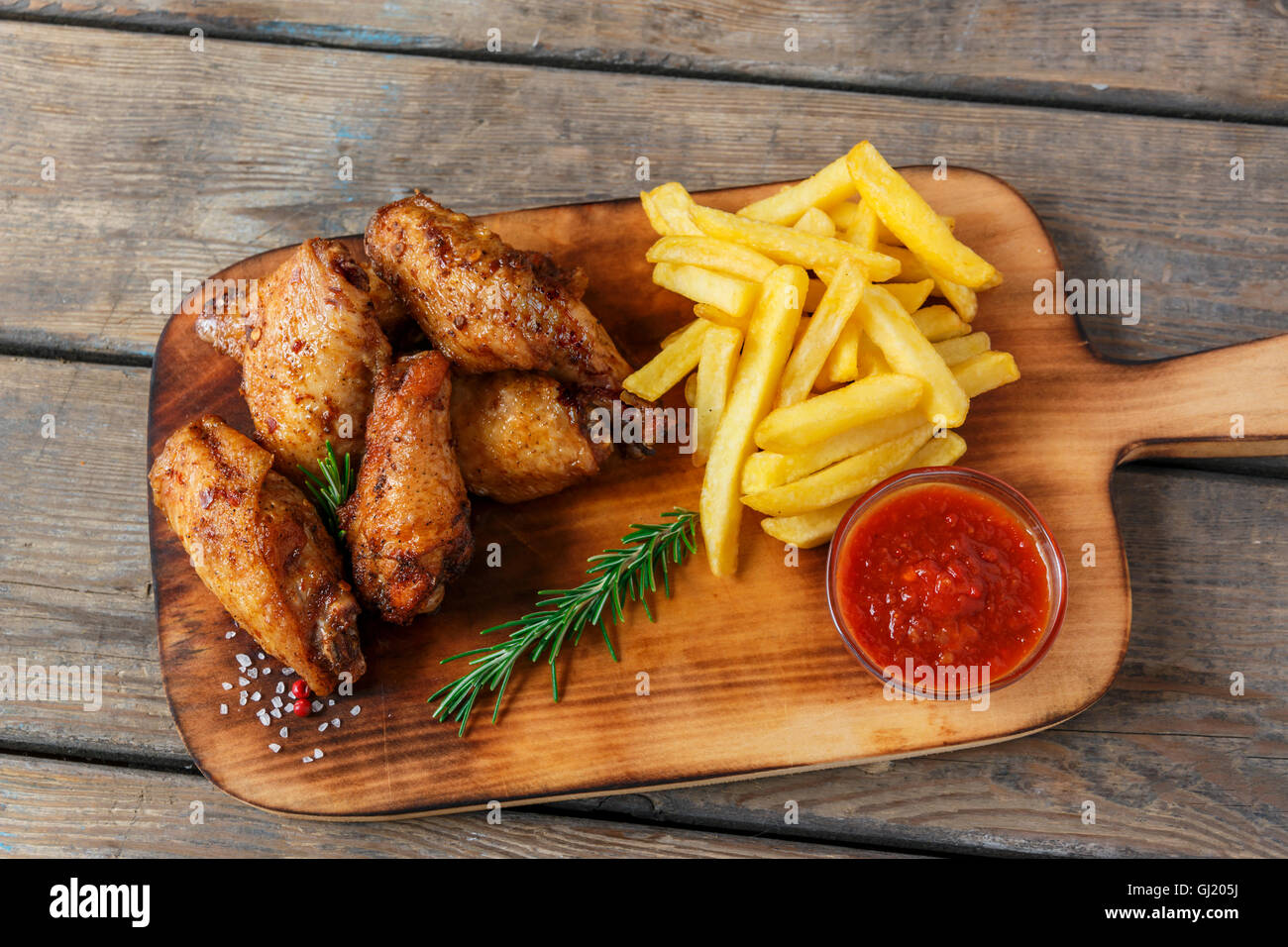 fried chicken wings french fries and sauce Stock Photo