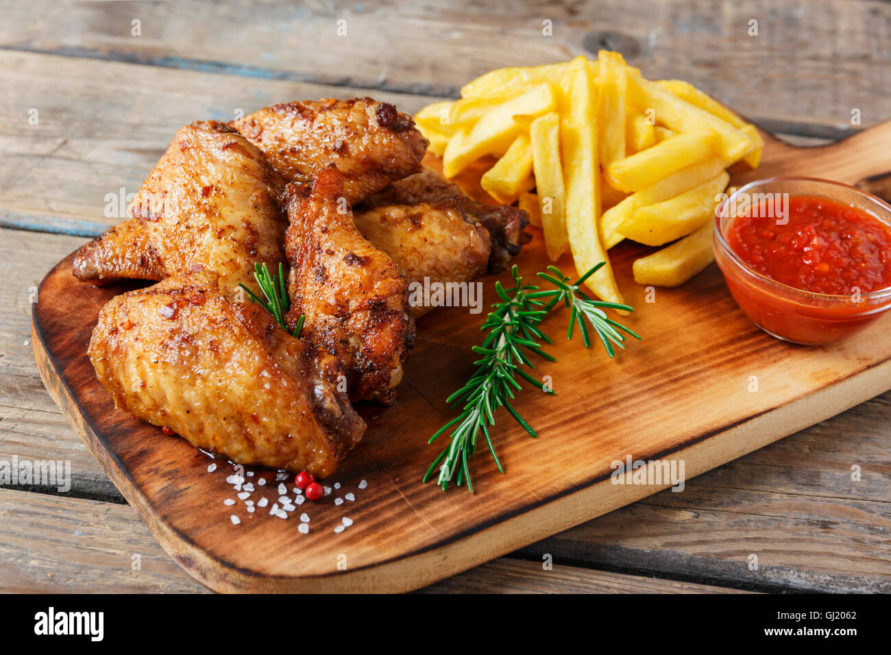 fried chicken wings french fries and sauce Stock Photo