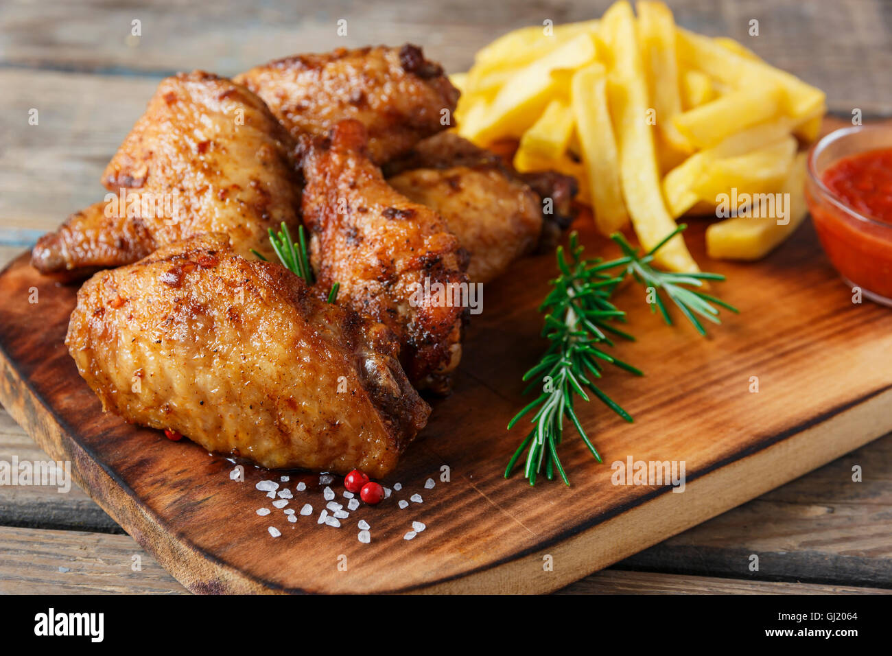 fried chicken wings french fries and sauce Stock Photo