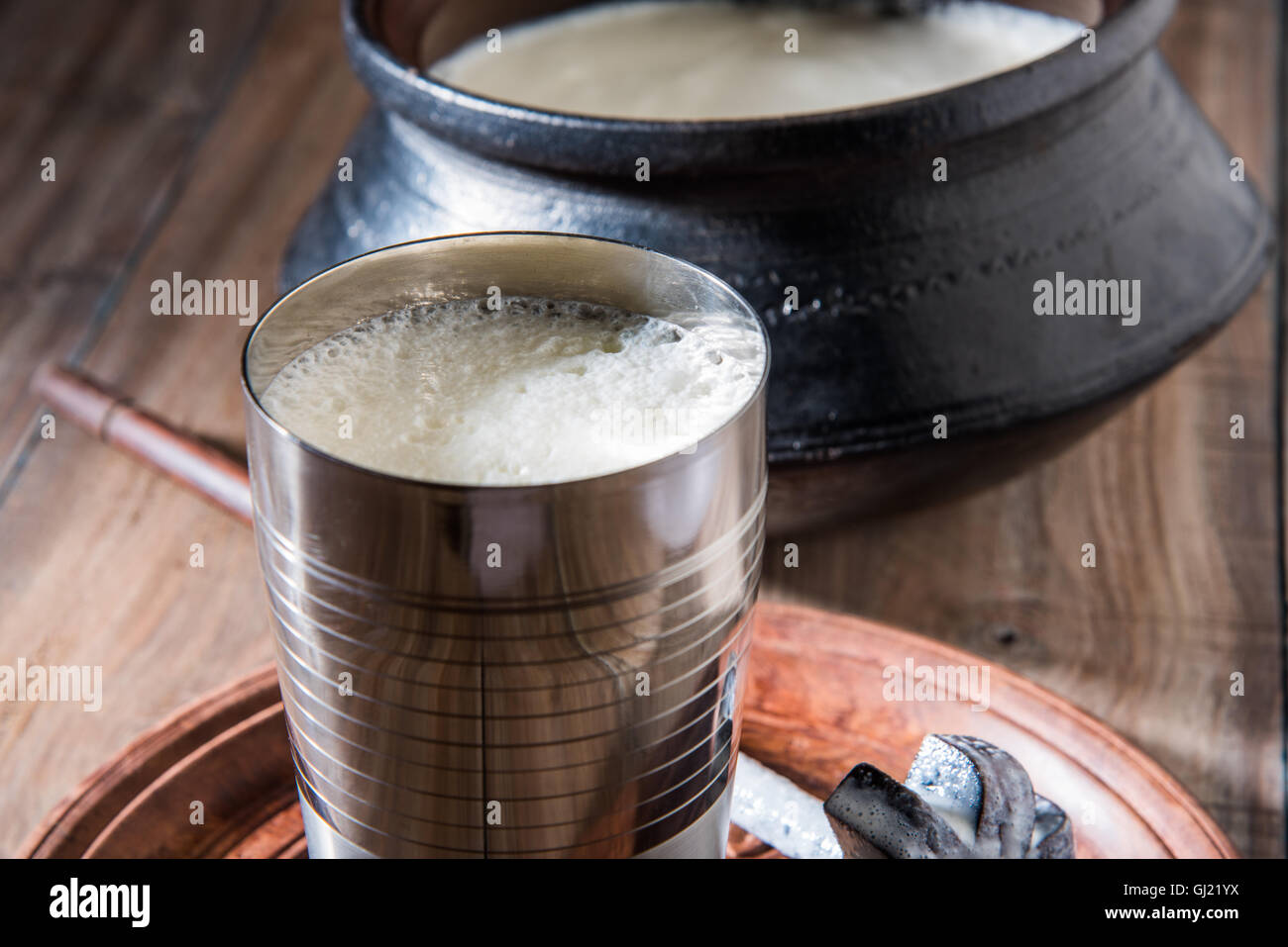 Indian sweet Lassi made up of milk, curd, sugar and salt mixed with ice ...