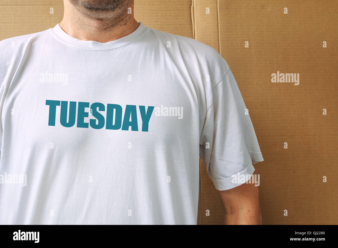 Days of the week - tuesday, man wearing white t-shirt with name of the second weekday printed Stock Photo