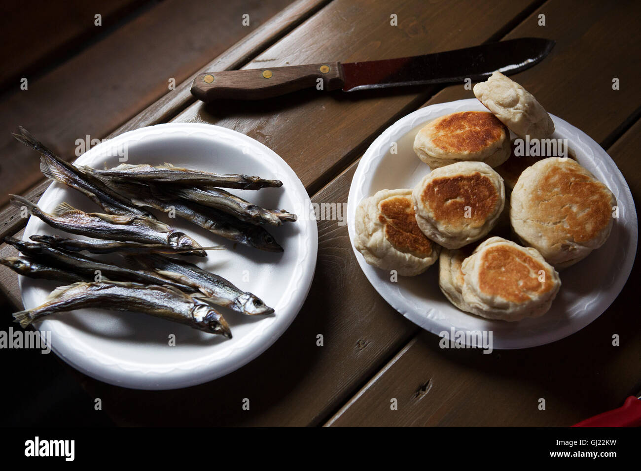Capelin fish and toutons served at Bay Roberts in Newfoundland and Labrador, Canada. The fish roll on the coastline of Newfoundl Stock Photo