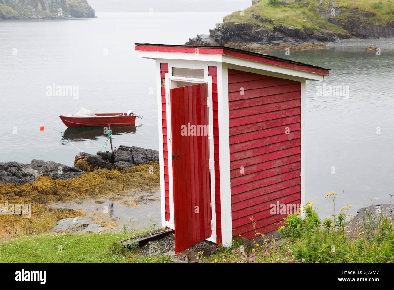 A red outhouse at Bay Roberts in Newfoundland and Labrador, Canada. Stock Photo