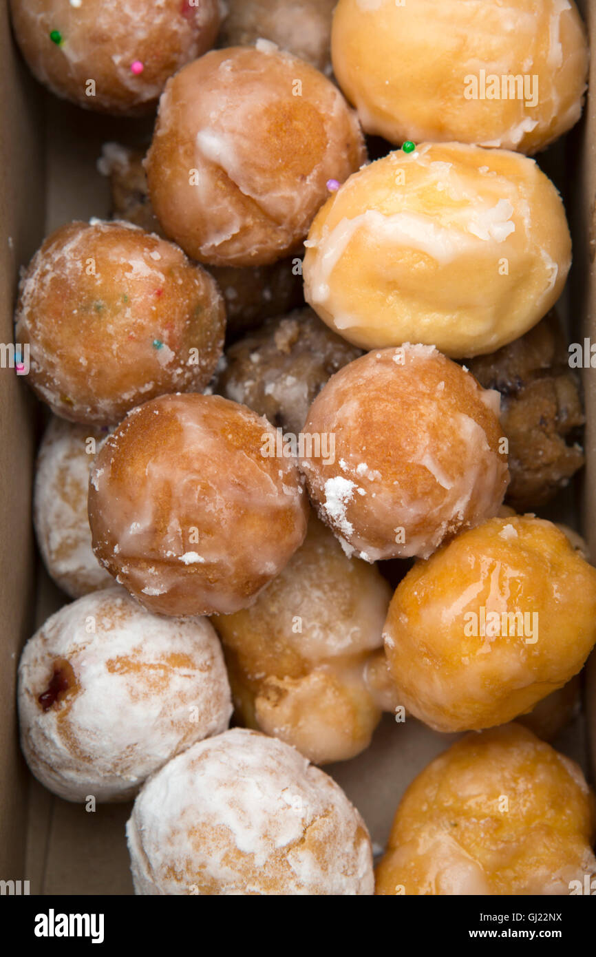 A box of Timbits served in Canada. The glazed, bite-sized pieces of doughnut are served at Tim Horton's stores. Stock Photo