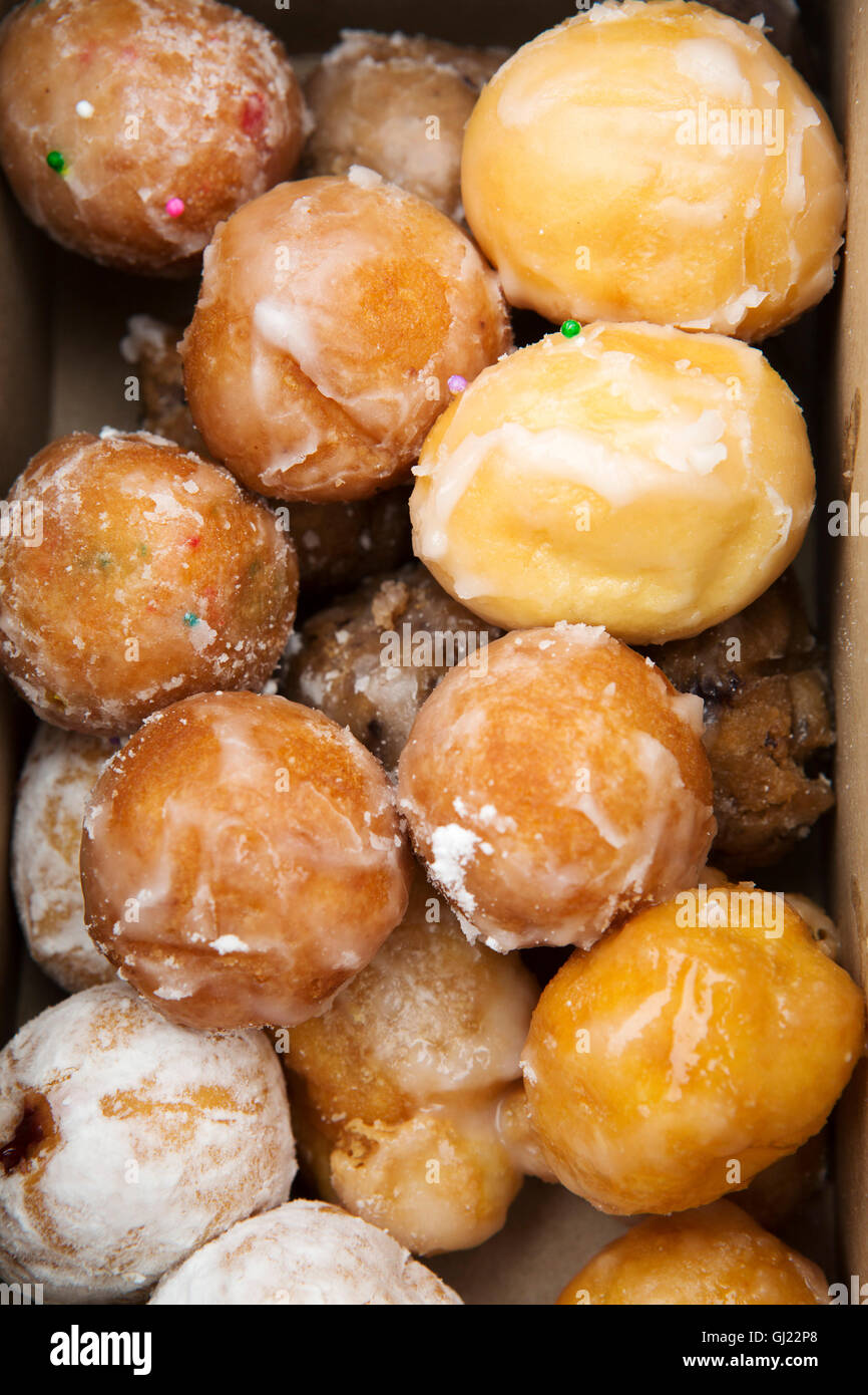 A box of Timbits served in Canada. The glazed, bite-sized pieces of doughnut are served at Tim Horton's stores. Stock Photo