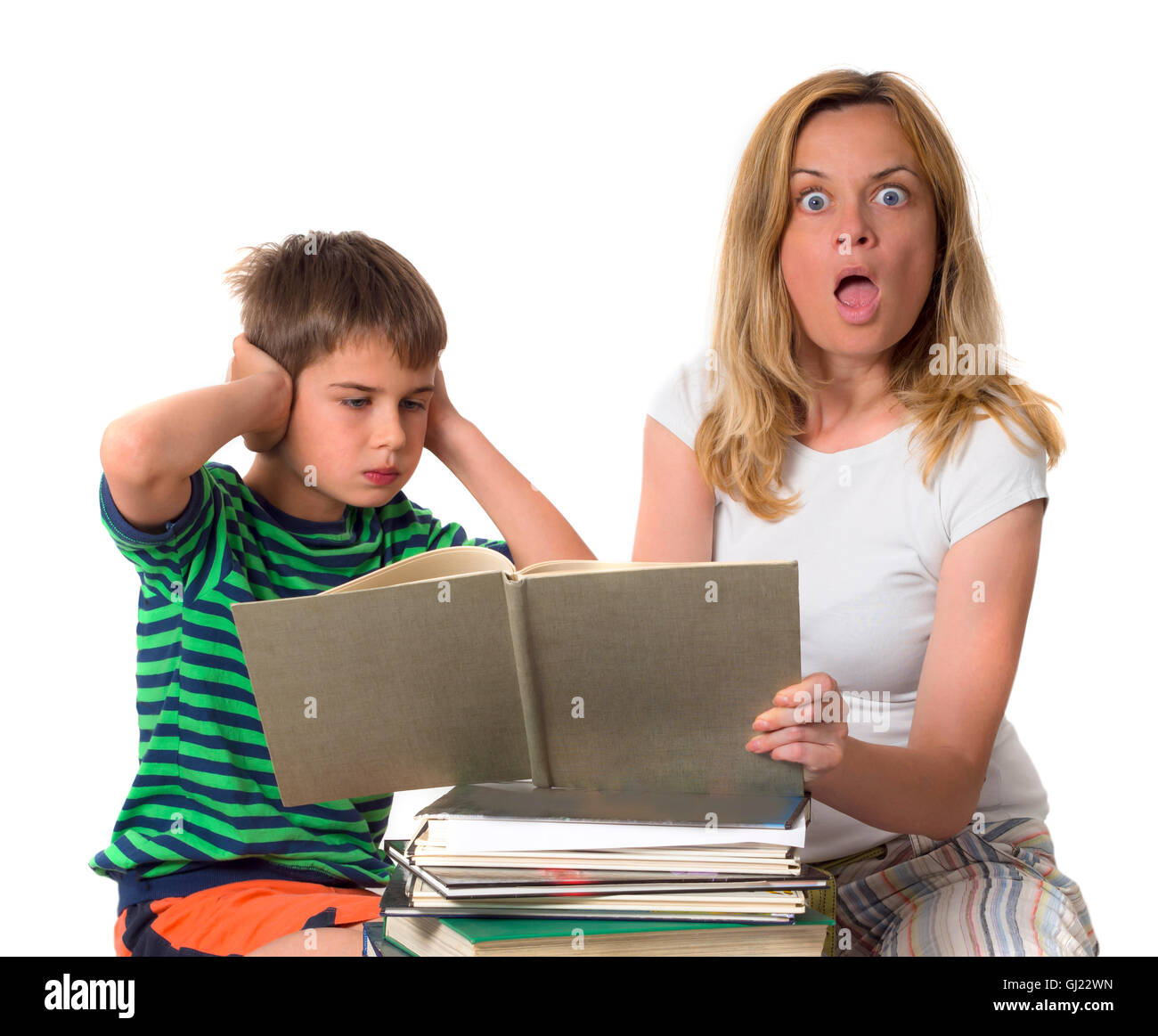 surprised mother trying to teach her son while he is confronting Stock Photo