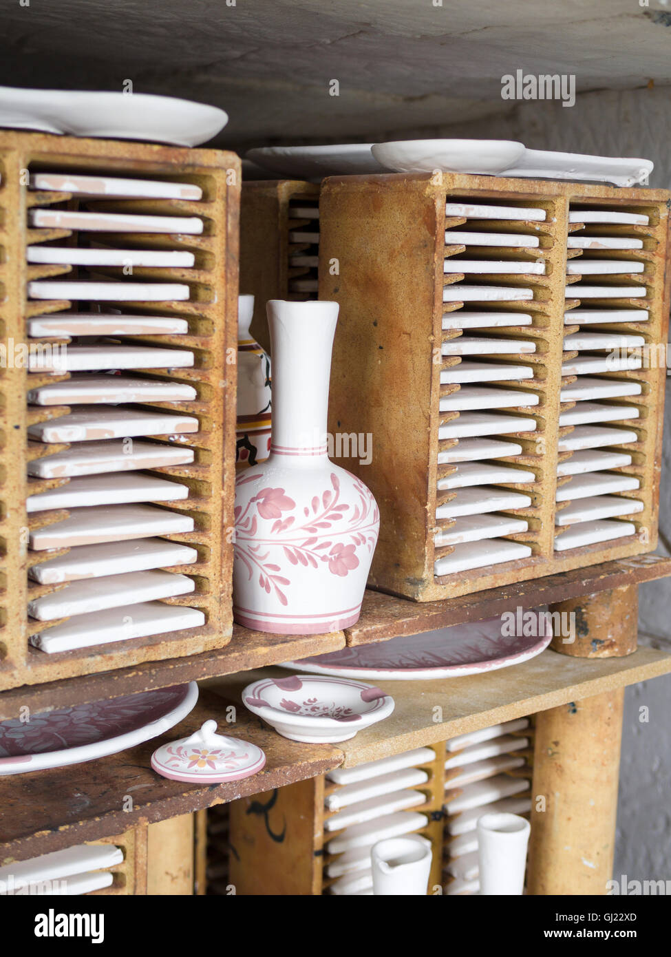 Ceramics Ready for Firing. Detail of a batch of pottery stacked inside