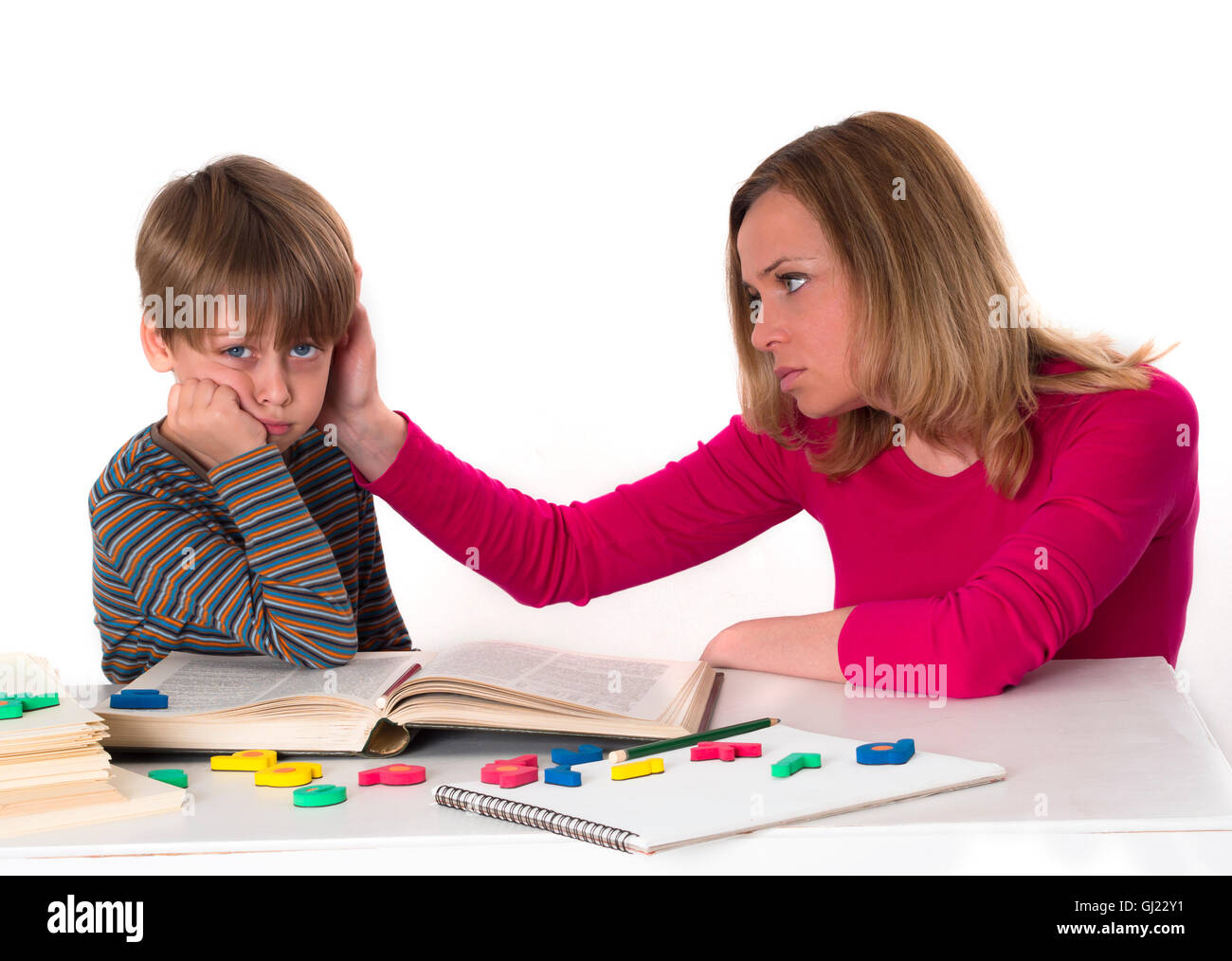 mother teaching her son Stock Photo