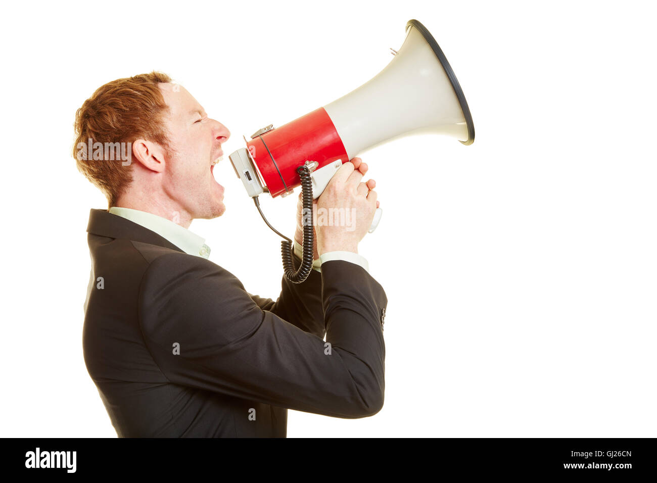 Businessman holding a megaphone and screaming and motivating people Stock Photo