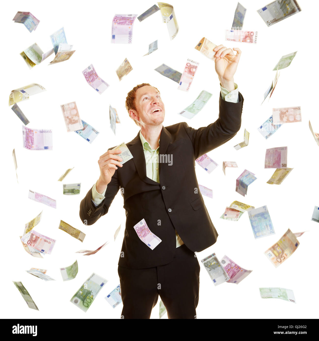 Happy businessman as a winner in a money rain Stock Photo