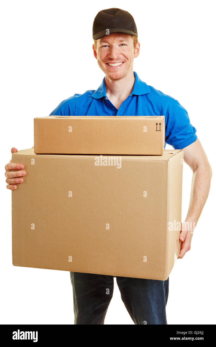 Delivery man smiling with two packages on his hands on a white background Stock Photo