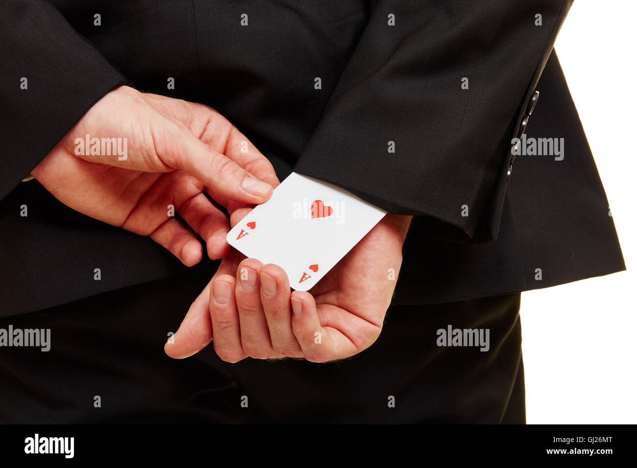 Hand from a businessman pulling an ace from a sleeve Stock Photo