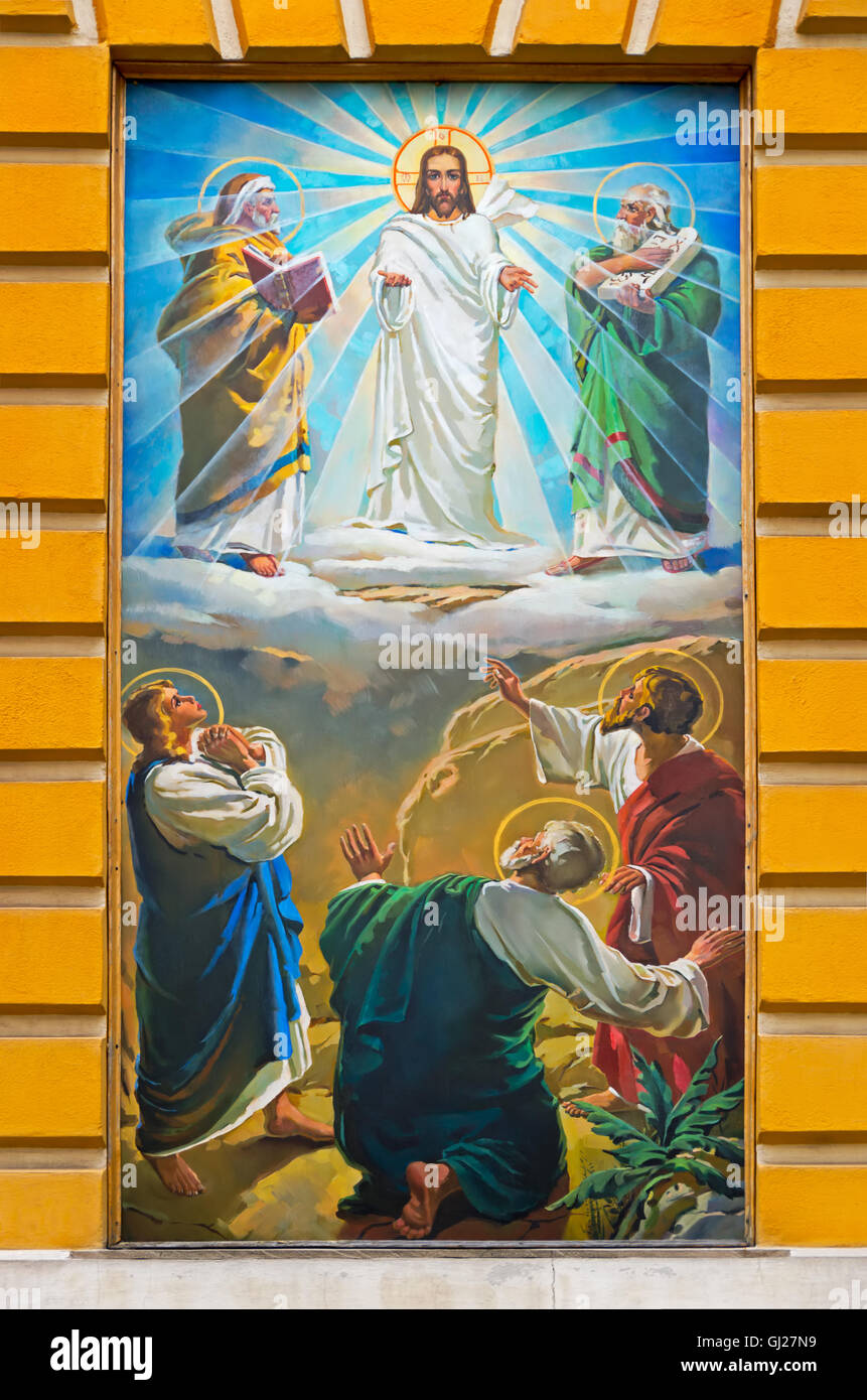 The restored mural Orthodox Cathedral on the wall marks Day of Holy Trinity Stock Photo