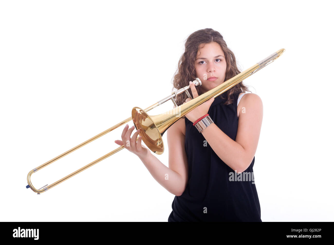 Teenage girl with trombone. Studio shot Stock Photo Alamy