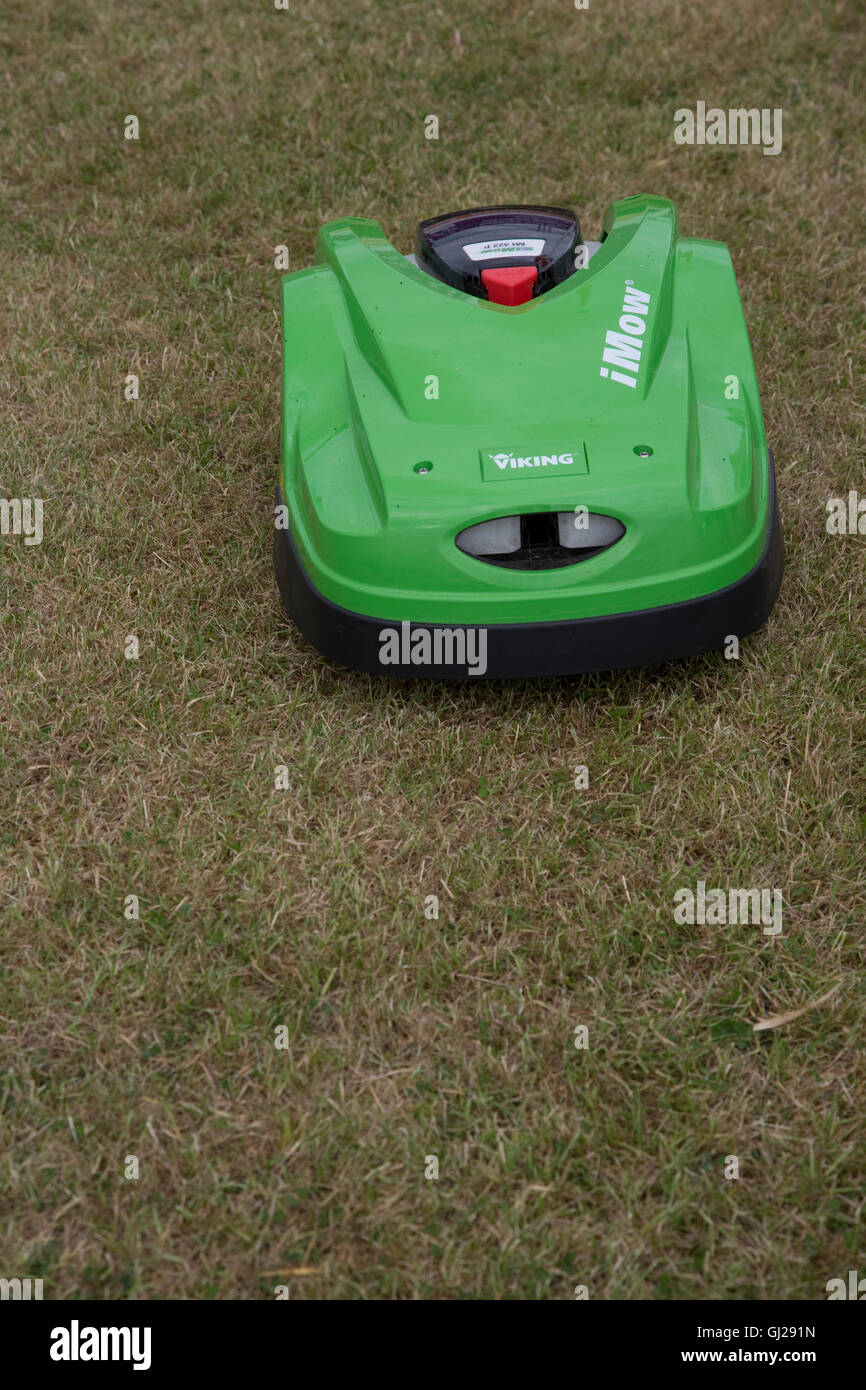 Green Viking MI 422 P iMow robotic lawn mower cutting grass Countryfile Live Blenheim UK Stock Photo