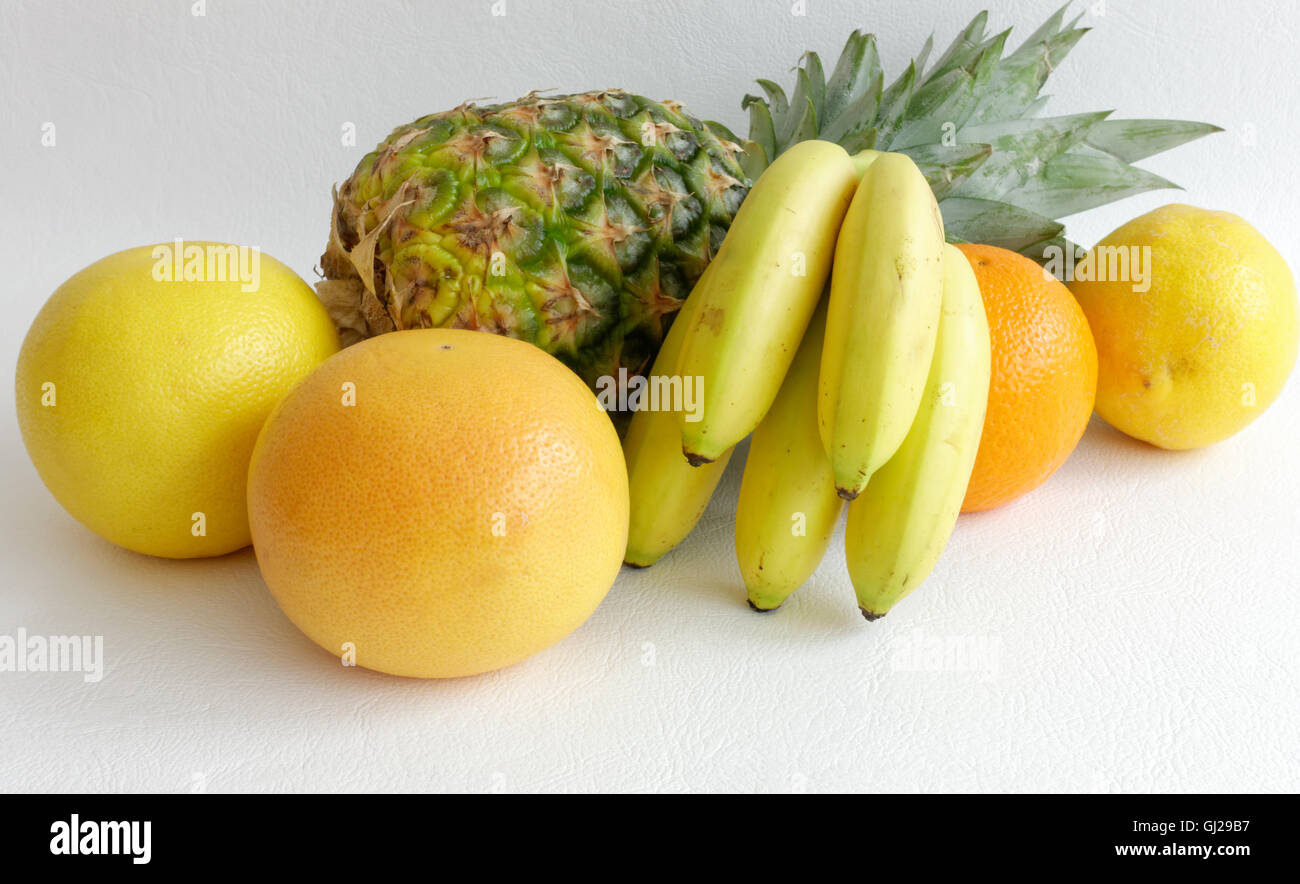 Composition of Pineapple, Orange, Grapefruits and Baby Bananas Stock